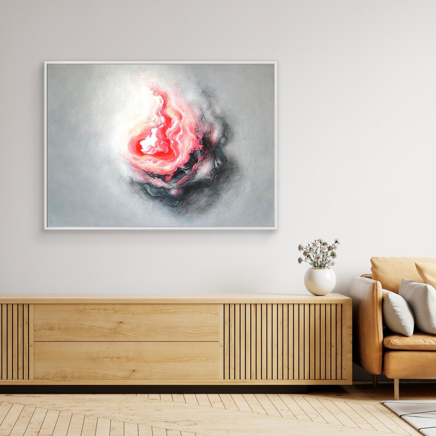 Large pink and grey abstract art on canvas in a contemporary living room 