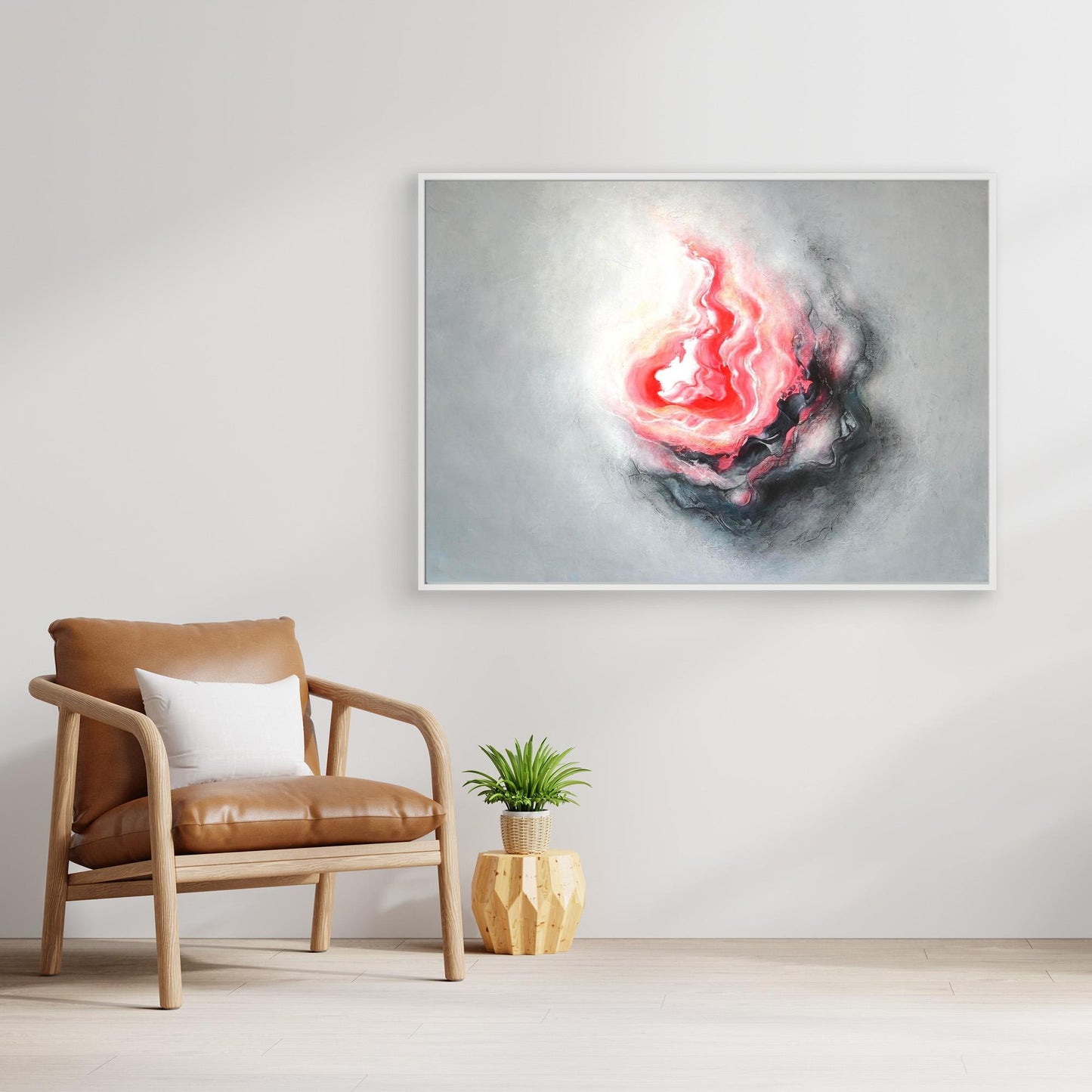 Large gray and pink abstract art print on canvas in a stylish setting 